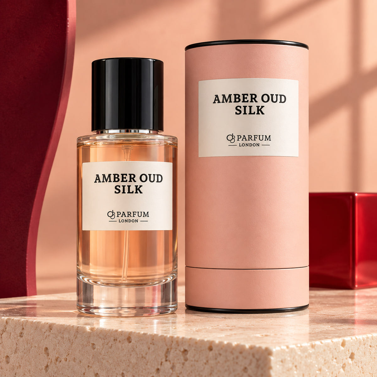 Amber Oud Silk 50 ml fragrance bottle and blush-peach presentation canister